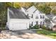 Two-story house with white siding, black shutters, and a long driveway at 112 Sugar Thyme Ln, Mooresville, NC 28115