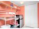 Convenient laundry room with sink and storage shelves at 112 Sugar Thyme Ln, Mooresville, NC 28115