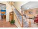 Wooden staircase leading to the upper level with a view to the living room at 112 Sugar Thyme Ln, Mooresville, NC 28115