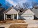 Charming single-Gathering home featuring a two-car garage and a welcoming front porch at 1200 Meander Ln, Waxhaw, NC 28173