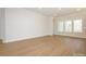 Bright living room boasts hardwood floors and many windows for natural light at 1200 Meander Ln, Waxhaw, NC 28173