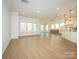 Spacious living room and kitchen area with hardwood floors and recessed lighting at 1200 Meander Ln, Waxhaw, NC 28173