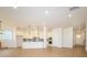 Open concept living room flowing into the kitchen, featuring hardwood floors and modern cabinets at 1200 Meander Ln, Waxhaw, NC 28173