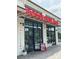 Eye-level view of a modern, brightly lit restaurant, Bossy Beulah's, with an inviting storefront and outdoor seating at 12110 Storm Ln # 49, Charlotte, NC 28277