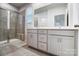 Elegant bathroom boasting double vanity, tiled shower, and modern fixtures at 2608 Tillman St, Monroe, NC 28112