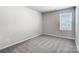 Bright bedroom featuring neutral walls, plush carpeting and a window with natural light at 2608 Tillman St, Monroe, NC 28112