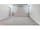 Spacious bedroom with neutral carpet and ample natural light from two windows at 2608 Tillman St, Monroe, NC 28112