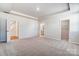 Bright bedroom showcasing plush carpeting, recessed lighting, and walk in closet at 2608 Tillman St, Monroe, NC 28112