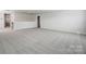 Expansive bonus room featuring neutral carpet and abundant natural light at 2608 Tillman St, Monroe, NC 28112
