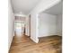 Bright hallway with wood floors leading to various rooms at 2608 Tillman St, Monroe, NC 28112