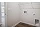 Conveniently located laundry room featuring hardwood style floors and modern hookups at 2608 Tillman St, Monroe, NC 28112
