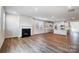 Living room that opens to the kitchen, featuring a fireplace and lots of light at 2608 Tillman St, Monroe, NC 28112