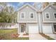 Charming two-story townhome with a one-car garage and freshly landscaped front yard at 9247 Eleanor Dr, Charlotte, NC 28214
