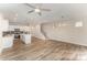 The living room has wood flooring and is open to the kitchen at 9251 Eleanor Dr, Charlotte, NC 28214
