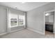 Well-lit bedroom featuring carpet, double windows, and en-suite bathroom at 2714 Stonewood Vw, Kannapolis, NC 28081