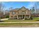 Two-story home with a brick facade, covered porch, and manicured lawn at 2714 Stonewood Vw, Kannapolis, NC 28081