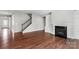 Hardwood floor living room with fireplace and staircase at 2714 Stonewood Vw, Kannapolis, NC 28081