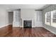 Living room features hardwood floors, fireplace, and built-in shelving units at 2714 Stonewood Vw, Kannapolis, NC 28081