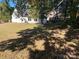 Expansive backyard featuring a well-maintained lawn and mature trees for privacy and shade at 4500 Doves Nest Ct, Matthews, NC 28105