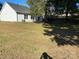 Spacious backyard with trees and green grass at 4500 Doves Nest Ct, Matthews, NC 28105