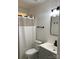 Bathroom featuring a toilet with a shower, modern vanity with black hardware, and a framed mirror at 4500 Doves Nest Ct, Matthews, NC 28105