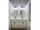 Updated bathroom with double sink vanity, modern fixtures, and neutral colors at 4500 Doves Nest Ct, Matthews, NC 28105