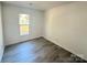 Cozy bedroom featuring updated floors, neutral walls, and lots of natural light at 4500 Doves Nest Ct, Matthews, NC 28105