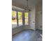 Dining area with large windows and light gray flooring at 4500 Doves Nest Ct, Matthews, NC 28105