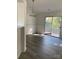 Bright dining area featuring updated flooring, wainscoting, and access to the backyard through sliding glass doors at 4500 Doves Nest Ct, Matthews, NC 28105