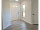 Bright entryway with natural light and light gray flooring at 4500 Doves Nest Ct, Matthews, NC 28105