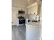 Clean kitchen with white cabinets, stainless steel appliances, and an undermount sink at 4500 Doves Nest Ct, Matthews, NC 28105