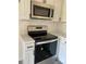 Up-close view of the new stainless steel oven and microwave appliances in the kitchen at 4500 Doves Nest Ct, Matthews, NC 28105