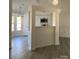 Open living space featuring modern gray flooring and a pass-through to the kitchen at 4500 Doves Nest Ct, Matthews, NC 28105