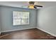 Bright bedroom with wood floors, ceiling fan, and ample closet space at 841 Settlement Dr, Clover, SC 29710