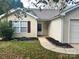 Home's exterior boasts a charming walkway and well-maintained landscaping at 841 Settlement Dr, Clover, SC 29710