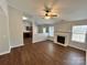 Spacious living room with hardwood floors, fireplace, and open kitchen view at 841 Settlement Dr, Clover, SC 29710