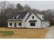 Charming two-story home with a modern farmhouse design and a covered front porch at 1020 N Shiloh Rd, York, SC 29745