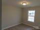 A simple room with light walls and wooden floors plus a double hung window at 130 Mason Tanner Ct # 7, Rock Hill, SC 29730