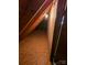 Spacious unfinished attic space with bare plywood and single lightbulb at 2304 Fox Hunt Dr, Monroe, NC 28110