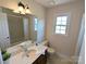 Clean bathroom with vanity, sink, and toilet at 2304 Fox Hunt Dr, Monroe, NC 28110