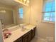 Bathroom with shower/tub combo and wood vanity at 2304 Fox Hunt Dr, Monroe, NC 28110