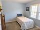 Small bedroom with twin bed and blue walls at 2304 Fox Hunt Dr, Monroe, NC 28110