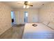Spacious bedroom with carpet and double doors to bathroom at 2304 Fox Hunt Dr, Monroe, NC 28110