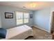Small bedroom with twin bed and blue walls at 2304 Fox Hunt Dr, Monroe, NC 28110
