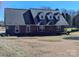 Brick ranch house with a gray roof, dormer windows, and a spacious yard at 2304 Fox Hunt Dr, Monroe, NC 28110