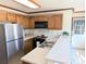 Kitchen boasts stainless steel appliances and oak cabinets at 2304 Fox Hunt Dr, Monroe, NC 28110