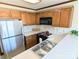 Kitchen with stainless steel appliances and oak cabinets at 2304 Fox Hunt Dr, Monroe, NC 28110