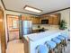 Galley kitchen with stainless steel appliances and oak cabinets at 2304 Fox Hunt Dr, Monroe, NC 28110