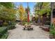 Charming community space with a picnic table under a red umbrella, surrounded by trees and walkways at 7095 Sunset Crater Pl, Lancaster, SC 29720