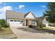 Lovely single-story home featuring a two-car garage, brick accents, and a well-kept front lawn at 7095 Sunset Crater Pl, Lancaster, SC 29720